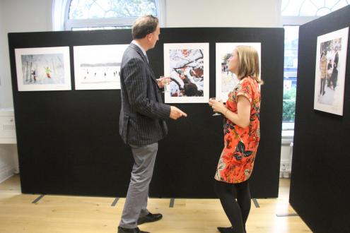 Guests discussing the photos