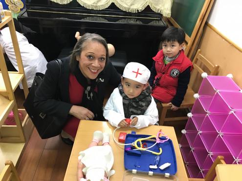 Head Teacher and Chinese Kindergarten Pupils